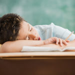 Boy sleeping on desk